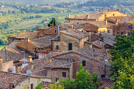 Tiled roofs below the medieval walls of Montepulciano in Tuscany, Italyの写真素材
