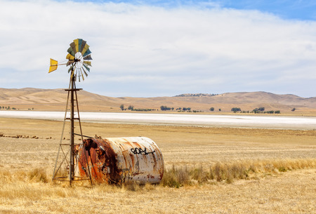 G'day on a water tank next to a wind wheel - SA, Australiaの写真素材