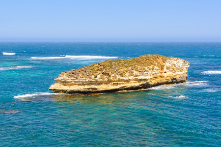 The sedimentary Lone Island looks like an ocean liner - Bay of Islands Coastal Park, Victoria, Australiaの写真素材