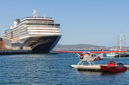 The MS Oosterdam  cruise ship and the seaplane of  Tasmanian Air Adventures in the harbour of Hobart - Tasmania, Australia, 6 February 2014のeditorial素材