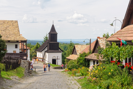 Visitors stroll along the Kossuth Street in the village - Holloko, Hungary, 13 July 2011のeditorial素材