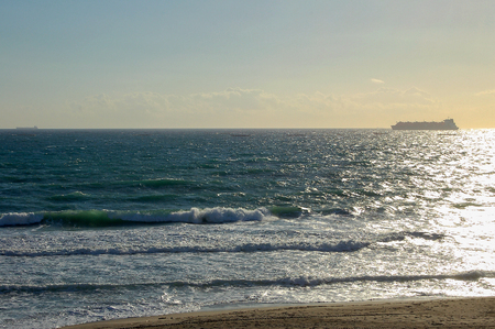 Gentle waves wash the beach - Gibraltarの写真素材