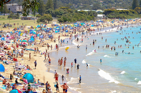 On a hot day vacationers try to cool off in the sparkling waters on Surf Beach at Loutit Bay - Lorne, Victoria, Australia, 13 January 2009のeditorial素材