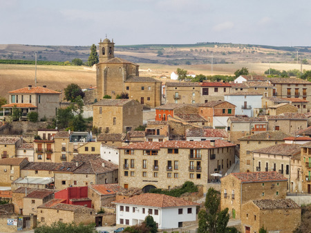 The octagonal Church of the Holy Sepulchre (Iglesia del Santo Sepulcro) dominates the skyline - Torres del Rio, Navarre, Spainの写真素材