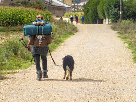 Camino pilgrim with his dog near Astorga - San Justo de la Vega, Castile and Leon, Spainの写真素材