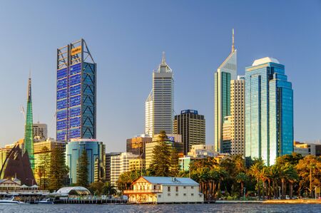 The floating clubhouse of West Australian Rowing Club at the feet of modern skyscrapers - Perth, WA, Australia, 14 December 2014のeditorial素材