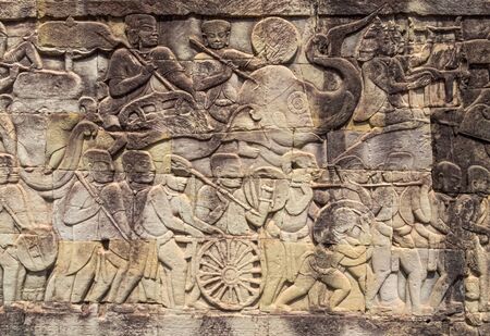 'Khmer army on the march', a scene from a gallery of the Bayon temple in Angkor Thom - Siem Reap, Cambodiaの写真素材