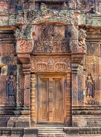 A richly decorated doorway of the 'Citadel of the Women' - Banteay Srei, Cambodiaの写真素材