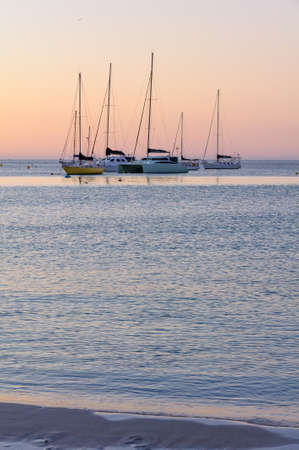 Yachts anchored in the bay at twilight - Dunsborough, WA, Australia