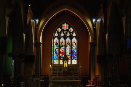 Stained glass window above the altar in Our Lady of the Rosary Catholic Church - Kyneton, Victoria,...