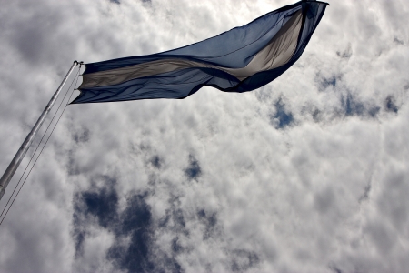 waving flag in the center of buenos aires argentinaの写真素材