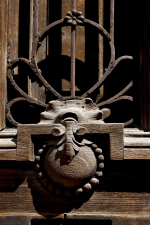brass brown knocker in a closed brown wood  door buenos aires argentinaの写真素材
