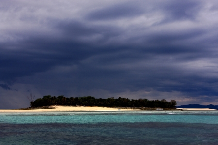  cloudy in indian ocean madagascar mountain  sand isle beach sky and boatの写真素材