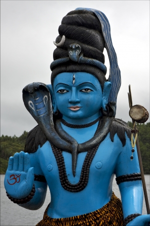 marble blue wood statue of a Hinduism  snake  Shiva vishnu Brahma in a temple near a lake in mauritius africaの写真素材