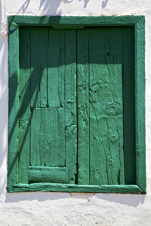 spain green wood   window in a white wall arrecife lanzaroteの写真素材