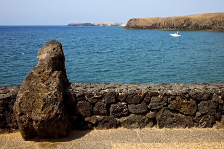 pavment lanzarote  in spain musk pond beach  water yacht boat  and summer 
の写真素材