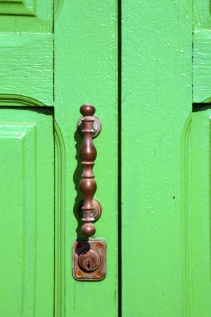 spain   brass knocker lanzarote abstract door wood in the green の写真素材