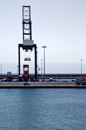 spain crane and harbor pier boat in the blue sky   arrecife teguise lanzarote の写真素材