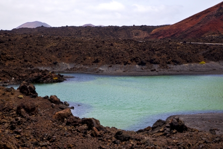car street people  stone  atlantic ocean sky  water lanzarote in el golfo  spain musk pond rock  coastline and summer 
の写真素材