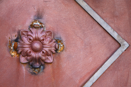 abstract  rusty brass brown knocker in a   closed wood door olgiate olona varese italyの写真素材