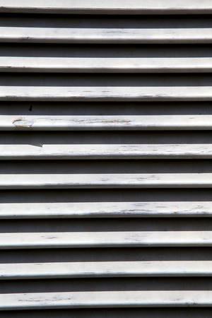 besnate window  varese italy abstract      wood venetian blind in the concrete  brickの写真素材
