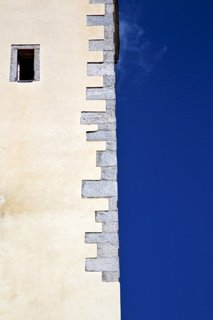 cross sumirago lombardy italy  varese abstract   wall of a curch broke brike pattern sunny day  and skyの写真素材
