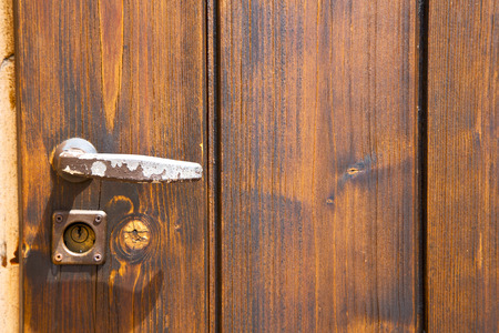 brebbia abstract   rusty brass brown knocker in a  door curch  closed wood italy  lombardyの写真素材