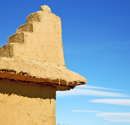 brown old  construction in  africa morocco and  clouds  near the towerの写真素材