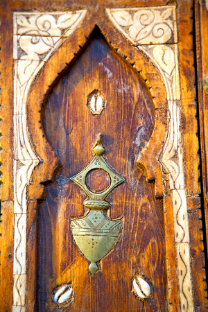 metal grey   morocco in    africa the old wood  facade home and rusty safe padlockの写真素材