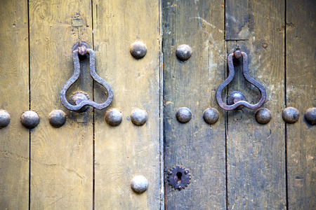 brown  morocco in africa the old wood  facade home and rusty safe padlock