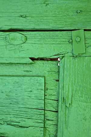 piece of colorated green wood as a window in lanzarote spainの写真素材