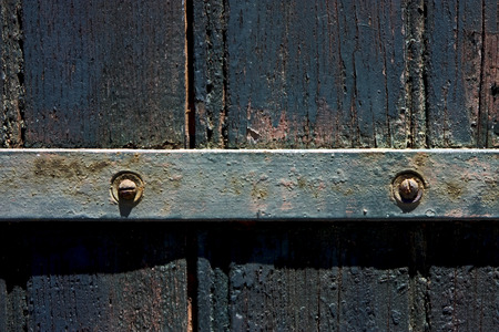 a old iron metal lock screw and wood in the centre of colonia del sacramento uruguay