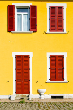 red window  varano borghi palaces italy   abstract  sunny day    wood venetian blind in the concrete  brickの写真素材