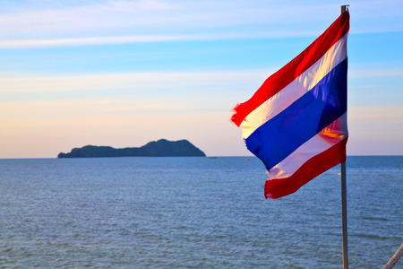 asia  lomprayah  bay isle sunrise flag   in thailand and south china seaの写真素材
