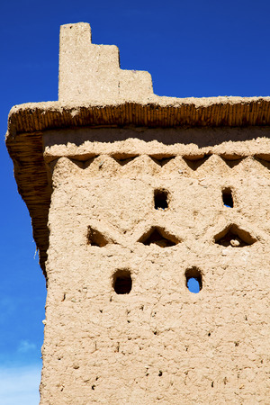 brown old  construction in  africa morocco and  clouds  near the towerの写真素材