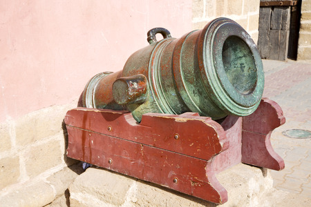 in africa morocco  green bronze cannon and the blue skyの写真素材