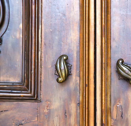 abstract  house door    in italy   lombardy   column  the milano old       closed nail