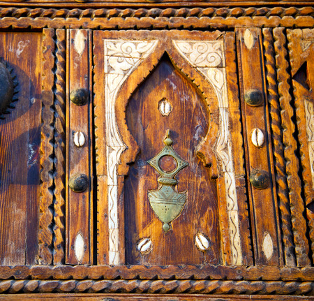 metal grey       morocco in    africa the old wood  facade home and rusty safe padlockの写真素材