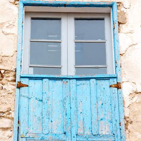 blue window in morocco africa old construction and brown wall  constructionの写真素材