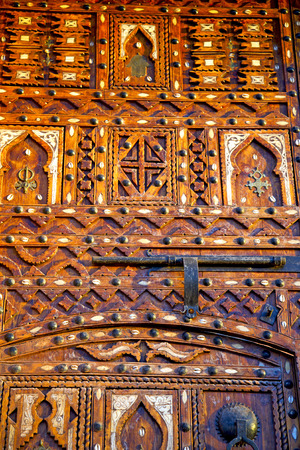 metal grey   morocco in    africa the old wood  facade home and rusty safe padlockの写真素材