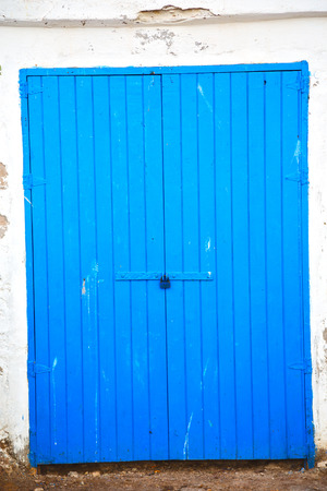 in africa morocco  old harbor wood   door and the blue skyの写真素材