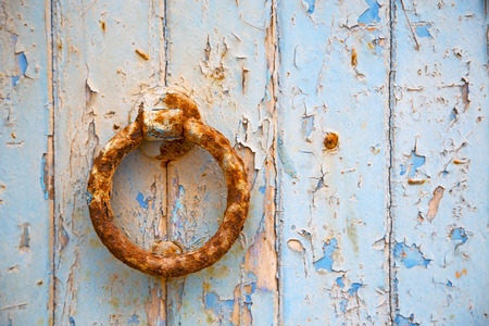 morocco knocker in africa the old wood  facade home and rusty safe padlockの写真素材
