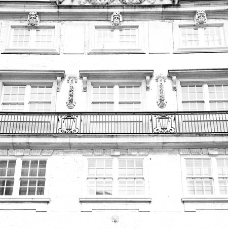 in europe london old red brick wall and    historical windowの写真素材