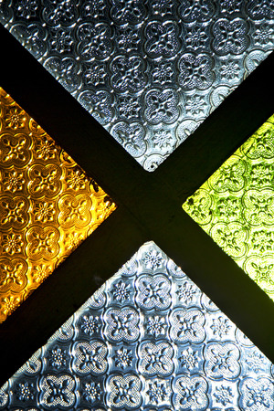 colorated glass and sun in morocco africa window and lightの写真素材
