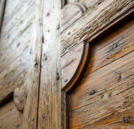 abstract  house door    in italy   lombardy   column  the milano old        closed nail rustyの写真素材