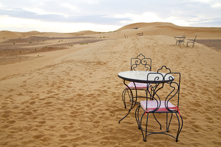 table and seat in  desert sahara morocco    africa yellow sandの写真素材
