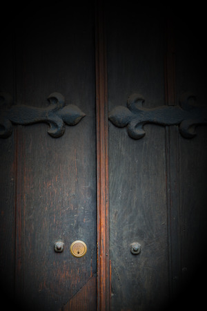 handle  in london antique brown door  rusty  brass nail and lightの写真素材