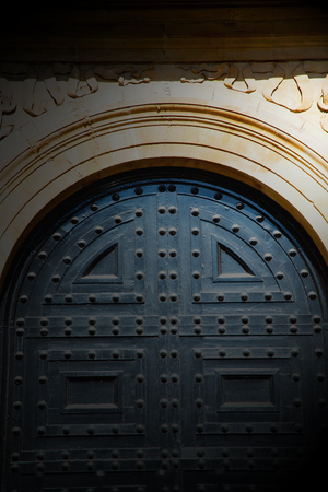 handle  in london antique brown door  rusty  brass nail and lightの写真素材