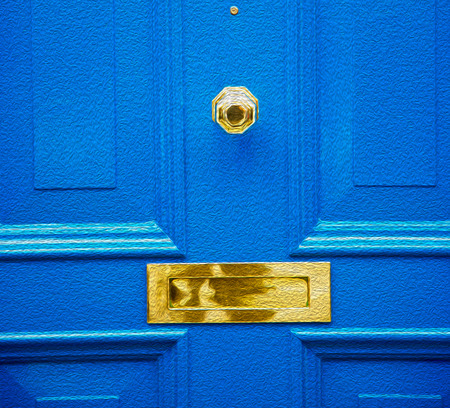 blue handle  in london antique  door  rusty  brass nail and lightの写真素材