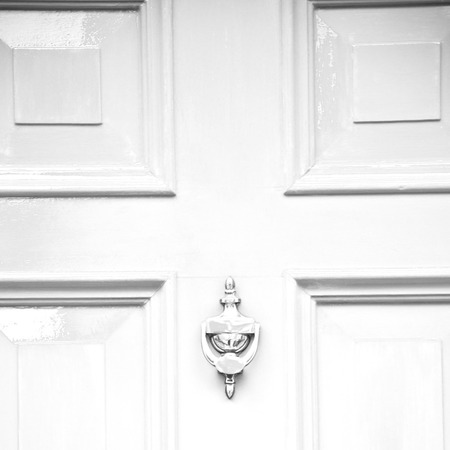 blue handle  in london antique  door  rusty  brass nail and lightの写真素材